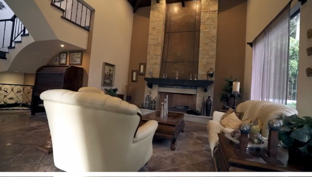 Grand living room with soaring stone fireplace