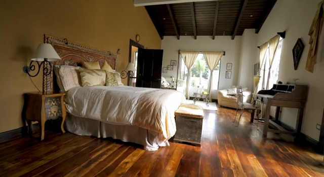 Master bedroom with carved headboard